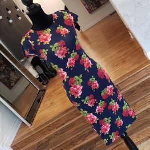 Pinup style open back stretchy floral dress.